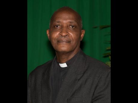 
Reverend Father Kingsley Asphall, pastor of Holy Cross Catholic Church, St Andrew.