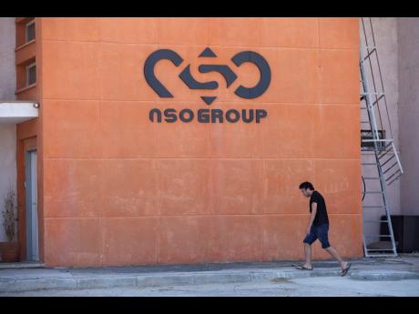 A logo adorns the wall on a branch of the Israeli NSO Group company, near the southern Israeli town of Sapir, on August 24, 2021.