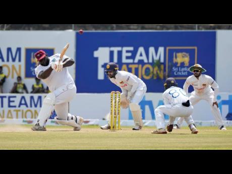 West Indies’ batsman Rahkeem Cornwall plays a shot during yesterday’s rain-shortened day three of their first Test cricket match against Sri Lanka in Galle, Sri Lanka.
