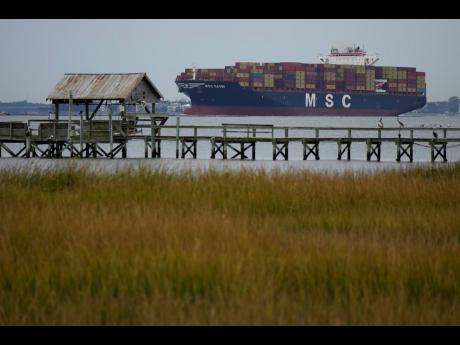 The MSC Naomi container ship sails out from from the port of Charleston, South Carolina on October 28, 2021. Hampered by rising COVID-19 cases and persistent supply shortages, the US economy slowed sharply to a 2% annual growth rate in the July-September p