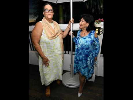 Wyvolyn Gager (left), The Gleaner’s first female editor-in-chief, and Consul of Ecuador Clelia Barreto de Hunter converse under the stars.
