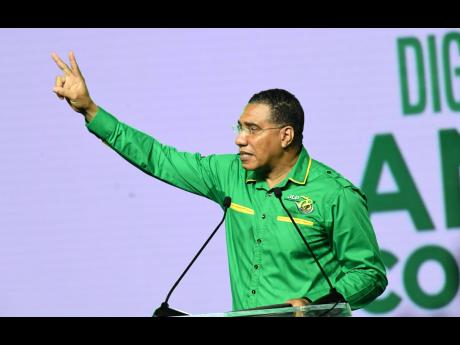 Credit: Rudolph Brown Prime Minister Andrew Holness speaking at the Jamaica Labour Party’s 78th annual conference at the National Indoor Sports Complex on Sunday.