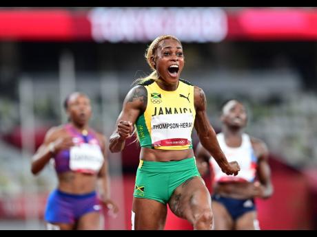 Jamaica’s Elaine Thompson-Herah reacts after winning in the women’s 100 metres final at the Tokyo 2020 Olympic Games in Tokyo, Japan.