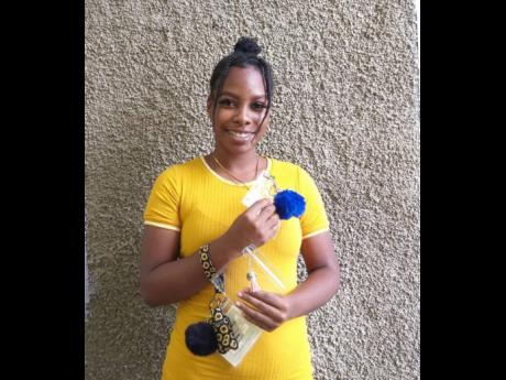 Budding entrepreneur Bahja Bent has created attractive holders for Jamaicans wanting to secure their COVID-19 vaccination cards as they carry them around.