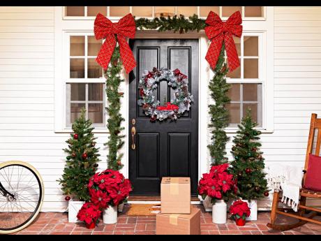 Frame the front door or wrap a railing with a lighted garland, and add a coordinating wreath, for a cozy, festive vibe.