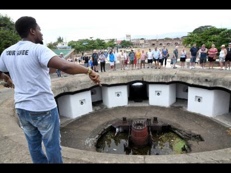Credit: File Jahnawne McLaren giving tourists a tour Fort Charles in Port Royal during a cruise call in January 2020.