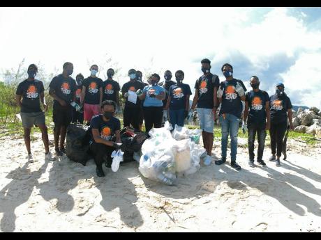 Some members of the Edu-Enchrichment team at a coastal clean-up project at the Harmony Beach Park and the River Bay Fishing Village in Montego Bay recently.