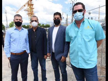 Family affair. From left are Jason Robinson, chief executive officer, Solar Buzz Jamaica; Gordon Robinson, chairman, Solar Buzz; Justin Robinson, head of the window film division, Solar Buzz; and Christian Tavares-Finson, attorney-at-law at Tavares, Finson