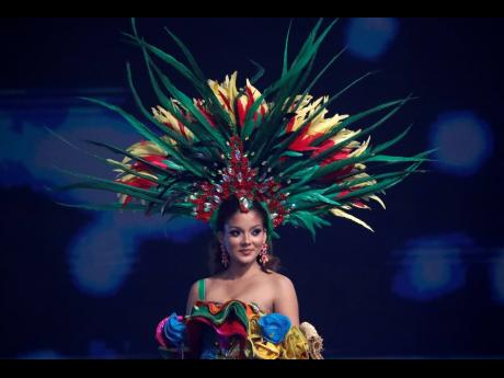 Jamaica's Deana Soares performs as she takes part in the national costume portion of the Miss Universe pageant. Soares' costume was inpired by the parish where she's from, and named as such — 'St Bess'.