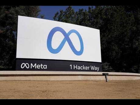 The new Meta sign at the company headquarters in Menlo Park, California, is seen October 28, 2021. Meta, formerly known as Facebook, and ridesharing company Lyft separately announced on December 7 that they are letting workers delay their return when offic