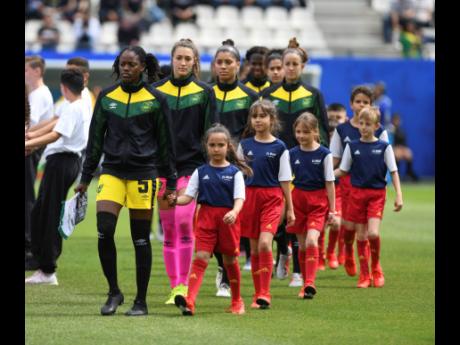 Credit: Gladstone Taylor Jamaica’s Reggae Girlz taking the field for a match against Brazil in the FIFA Women’s World Cup 2019 at the Stade des Alpes in Grenoble, France.