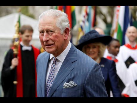 
Prince Charles and Camilla the Duchess of Cornwall (in the background).