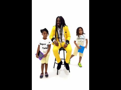 Majah Bless with his creative SuperTwinz, Ngozi (left) and Tafari, who turned nine years old on September 29.