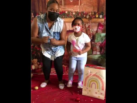 Shelly Ann Rowe rocking away with little Kyra Grace Pitter.