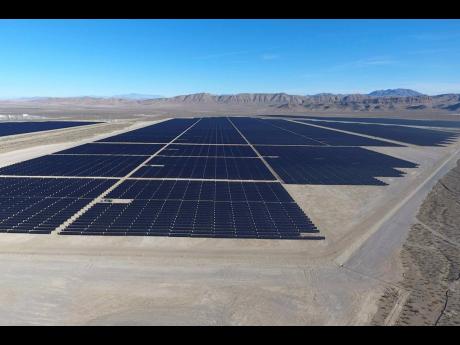 Solar arrays line the desert floor of the Dry Lake Solar Energy Zone in Las Vegas.