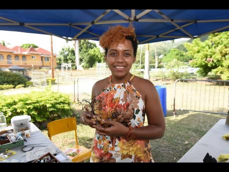 Author and jewellery designer Brianna Leigh-An Johnson speaks about her artwork and also her new book during a craft fair that was held at the Jamaica Horticultural Showground in St Andrew last Saturday.