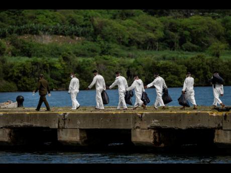  In this June 29 file photo, the US Coast Guard repatriates 18 Cuban nationals who were found at sea attempting to migrate illegally into the United States. AP 
