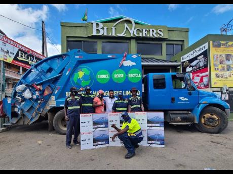 Mark Pai (fourth, left) with garbage collectors and their TV sets. 