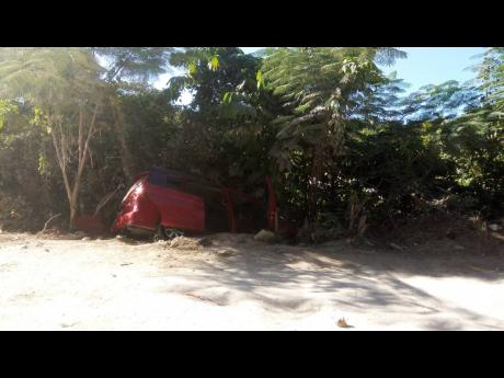 The Toyota motor car, which was being driven by 33-year-old Jermaine Evans in a section of Tucker, St James, yesterday when it was shot up by gunmen. Evans and his uncle, 46-year-old Peter Stewart, who was a passenger in the vehicle, later died.