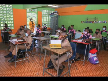 Credit: Ashley Anguin Grade six students of the Sudbury All-Age and Infant School in St James on their first day back to school for face-to-face classes since the COVID-19 pandemic.