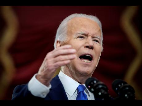 President Joe Biden speaks from Statuary Hall at the US Capitol, yesterday in Washington, to mark the one-year anniversary of the January 6 riot at the US Capitol by supporters loyal to then President Donald Trump. 
