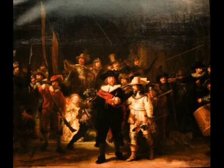 Credit: AP View of Rembrandt’s biggest painting the Night Watch showing the ripple in the painting in the top left corner, in Amsterdam, Netherlands, June 2021.