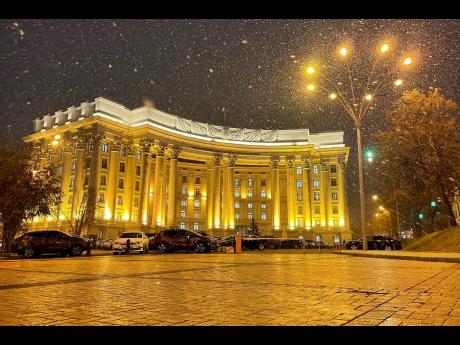 The building of the Ukrainian Foreign Ministry is seen during snowfall in Kyiv, Ukraine. Ukrainian officials and media reports say a number of government websites in Ukraine are down after a massive hacking attack.