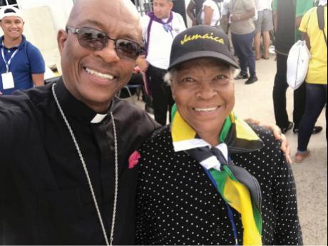 Archbishop Kenneth Richards (left), shares lens time with his mother, Holdroyd McDonald.