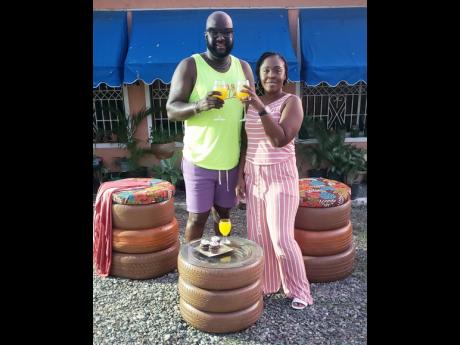 Credit: Contributed Plant parents Karl and Nicolette Brown are surrounded by the garden furniture they designed.