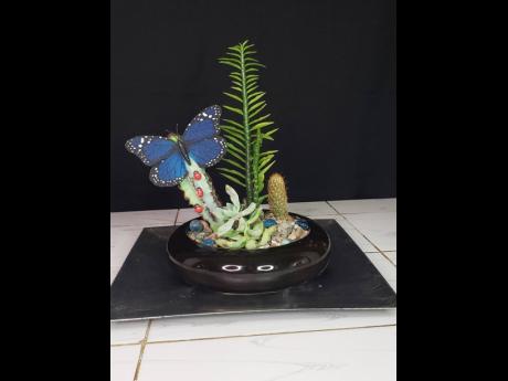 Credit: Contributed You will find the motif of butterflies and ladybugs throughout Khalil Brown Plant Salon pieces.