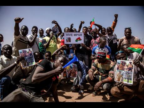 People take to the streets of Ouagadougou, Burkina Faso, yesterday to rally in support of the new military junta that ousted democratically elected President Roch Marc Christian Kabore and seized control of the country.