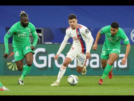 Lyon’s Bruno Guimaraes (centre) controls the ball ahead of  Saint-Etienne’s Maxence Rivera (left) and Aimen Moueffek during the French League One match between Lyon and Saint Etienne on January 21. Guimaraes is one of five top players bought by Newcast