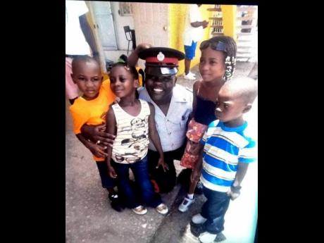 Sergeant Deane Cover, along with children.