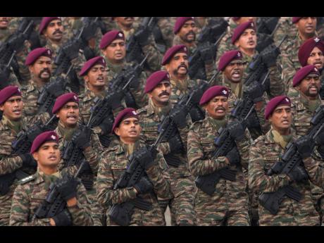 Indian army commandos march through the ceremonial Rajpath boulevard.
