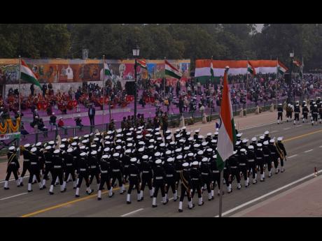 Indian naval soldiers march through the ceremonial Rajpath boulevard during Republic Day celebrations, in New Delhi, India, Wednesday, Jan. 26, 2022. The day marks the anniversary of the adoption of the country’s constitution in 1950. (AP Photo/Manish Sw