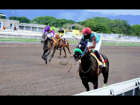 LEGALITY,  a 7-1 shot ridden by Matthew Bennett,  wins the Allan E. ‘Billy’ Williams Memorial Trophy over seven furlongs at Caymanas Park yesterday.