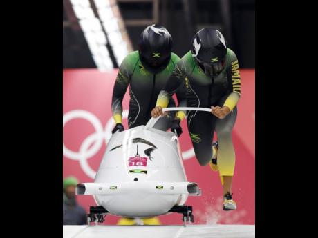 Credit: File This file photo shows driver Jazmine Fenlator-Victorian (right) and Carrie Russell of Jamaica start their first heat during the two-woman bobsled competition at the 2018 Winter Olympics in Pyeongchang, South Korea.