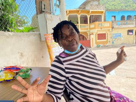Credit: Photo by Ainsworth Morris Reverend Dorothy Price Maitland from African Gardens expressing how thankful she is about the peace the youth from the August Town community have continued to maintain over the years.