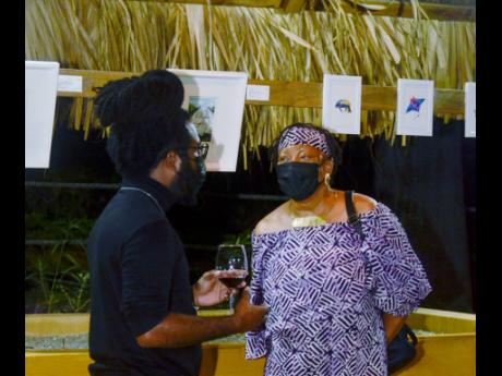 Visual artist Richard Nattoo (left), in conversation with storyteller and author, Dr Amina Blackwood Meeks, who supported the initiative on Sunday.