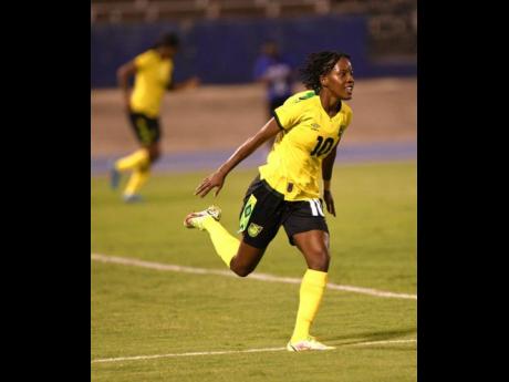 Jody Brown celebrates after scoring Jamaica's opening goal against Bermuda in Thursday's  Concacaf Women's World Cup qualifier at the National Stadium. Jamaica won 4-0.