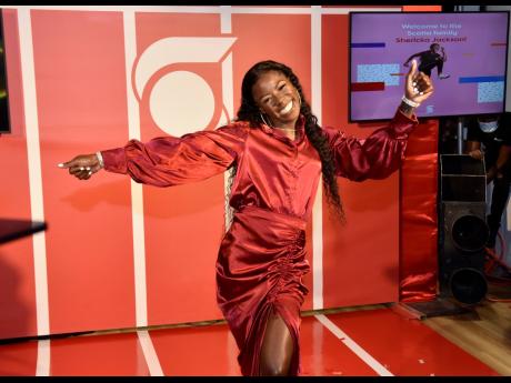 Shericka Jackson stunned in Scotia’s famous red and white, ‘Styled to Roc’ in silk. 