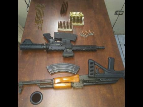 Guns found by the St James police in Green Pond last week.