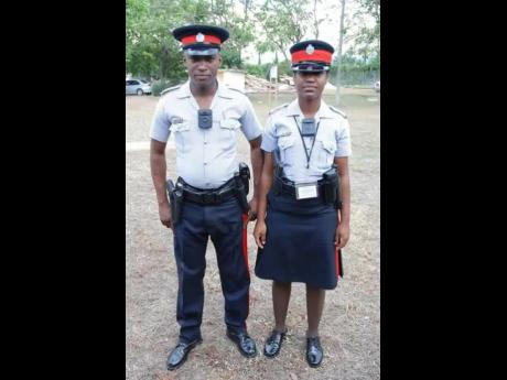 Two members of the JCF outfitted with body cameras