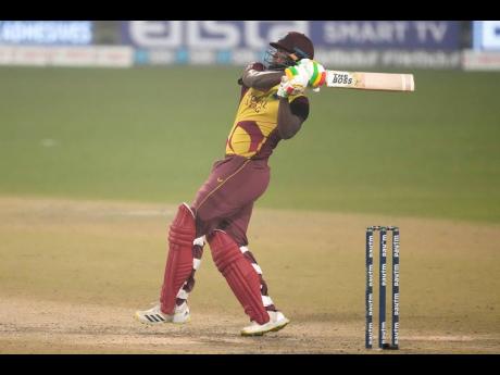 West Indies’ Romario Shepherd hits a six during the third Twenty20 international cricket match between India and West Indies in Kolkata, India yesterday.