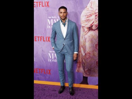 Isha Blaaker made a statement in Canali, adding a touch of sophistication to his look with a scarf. 