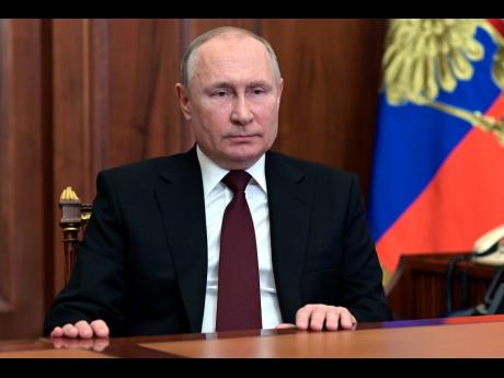 Russian President Vladimir Putin addresses the nation in the Kremlin in Moscow.