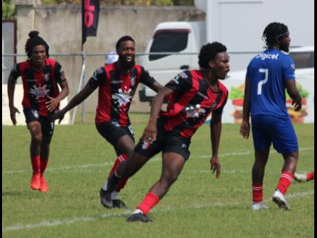 Credit: Lennox Aldred Arnett Gardens goal-scorer Luca Kung (second right) runs away from his teammates after opening the scoring against Dunbeholden in the Jamaica Premier League match on Monday at the Drax Hall Sports Complex.