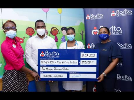 The University Hospital of the West Indies Neonatal Unit has benefited from new equipment through a donation from the Zayn B. Ennis  and Barita foundations. Dr Jillian Lewis (left) and Nurse Claudiann Nelson-Rodney (second right) receive the symbolic $100,
