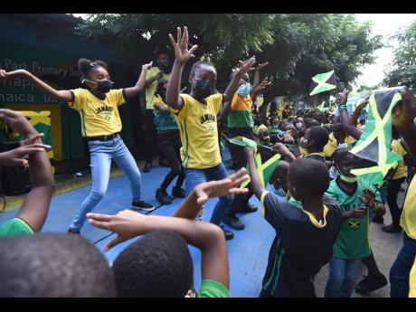 Credit: Ian Allen Students of Maxfield Park Primary School in St Andrew perform the different Jamaican dance moves while celebrating Jamaica Day at their school on February 25.