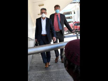 Gerard Borhols (left) and Ronald Steen, Dutch investigators from the Central Authority of the Netherlands, prepare to enter the Supreme Court for a hearing of the Trafigura matter on Tuesday.